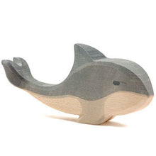 Wooden toy whale on a white background