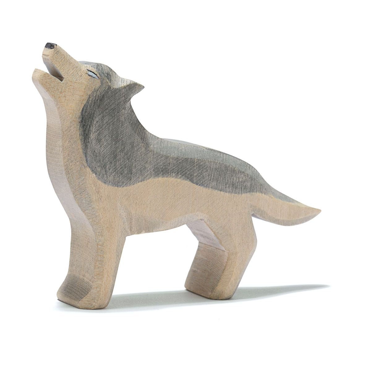 Wooden howling wolf figurine on a white background