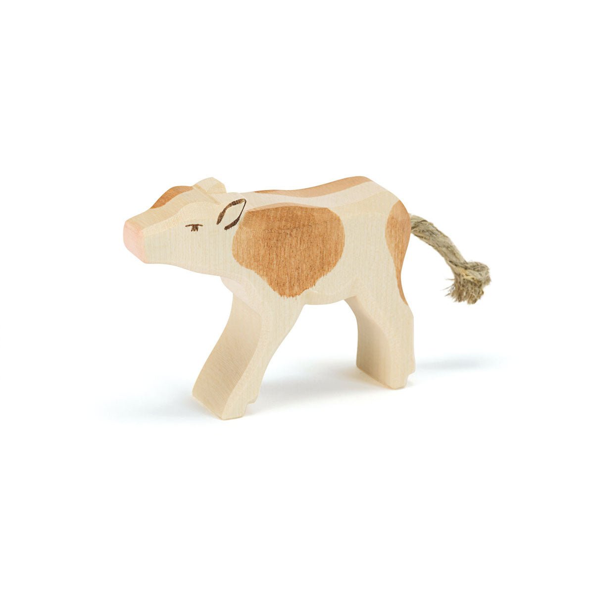 Wooden calf toy on a white background