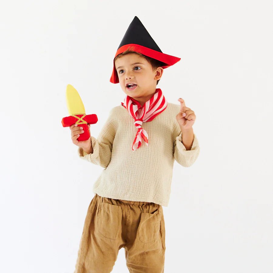 Child in a pirate costume, wearing a black pirate hat and carrying a red and yellow dagger