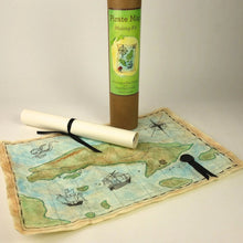 Pirate-themed map making kit with a map and cylindrical container on a light background