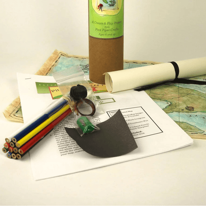 Pirate Map Making Kit with cylindrical container, map, and tools on a white background