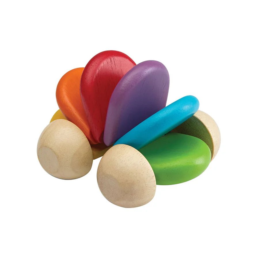 rainbow colored wooden toy car on a white background 2