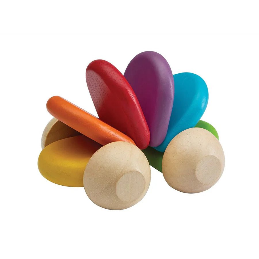 rainbow colored wooden toy car on a white background