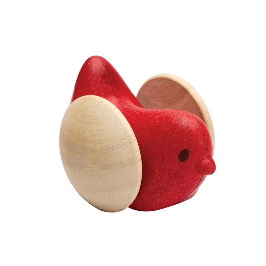 Wooden red bird toy on a white background