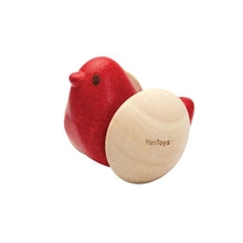 Red wooden bird toy on a white background