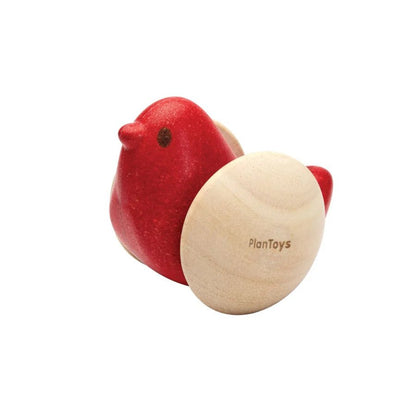 Red wooden bird toy on a white background
