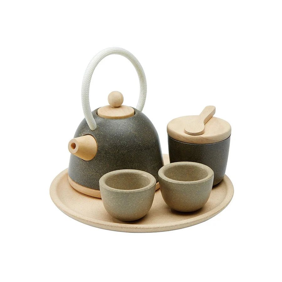 Wooden play tea set with teapot, bowl, cups, and tray on a white background