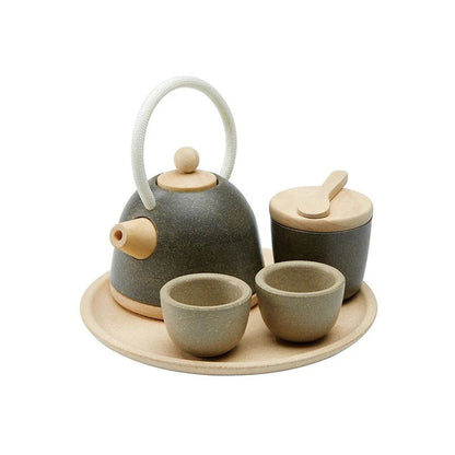 Wooden play tea set with teapot, bowl, cups, and tray on a white background