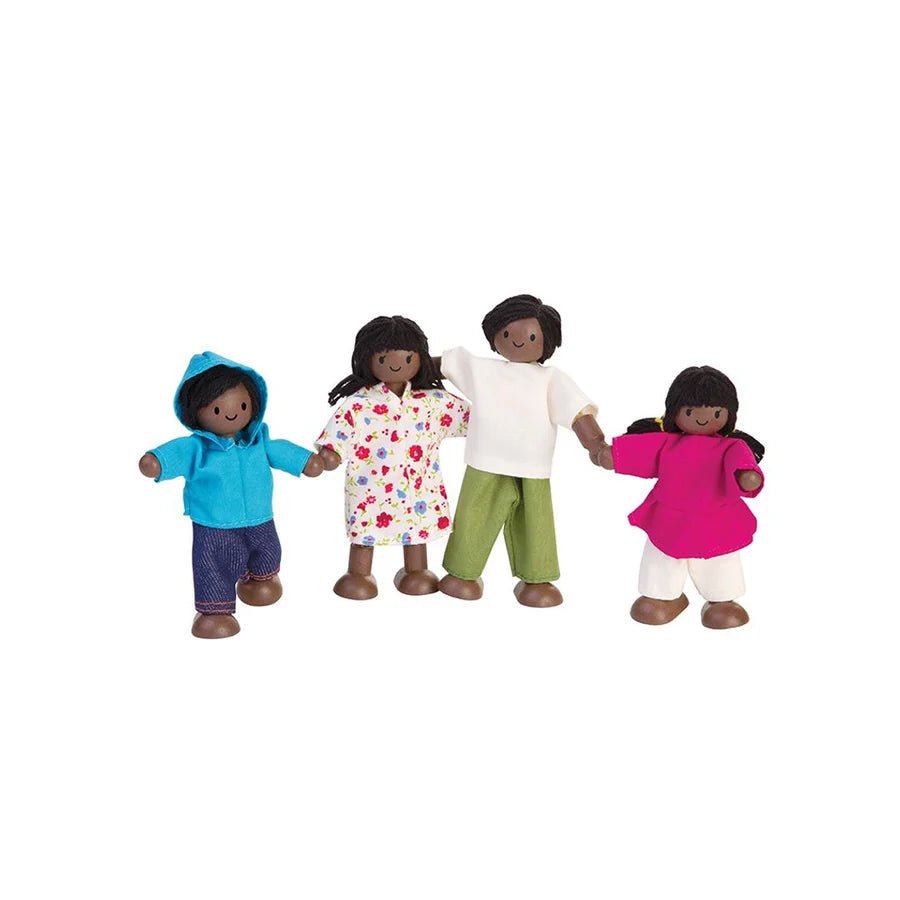 4 wooden dolls with dark skin and dark hair lined up in a row on a white background