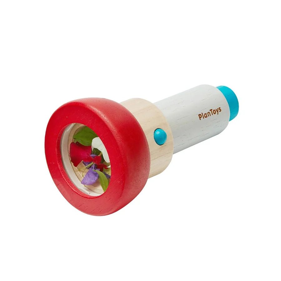 PlanToys wooden kaleidoscope with flowers and leaves inside on a white background