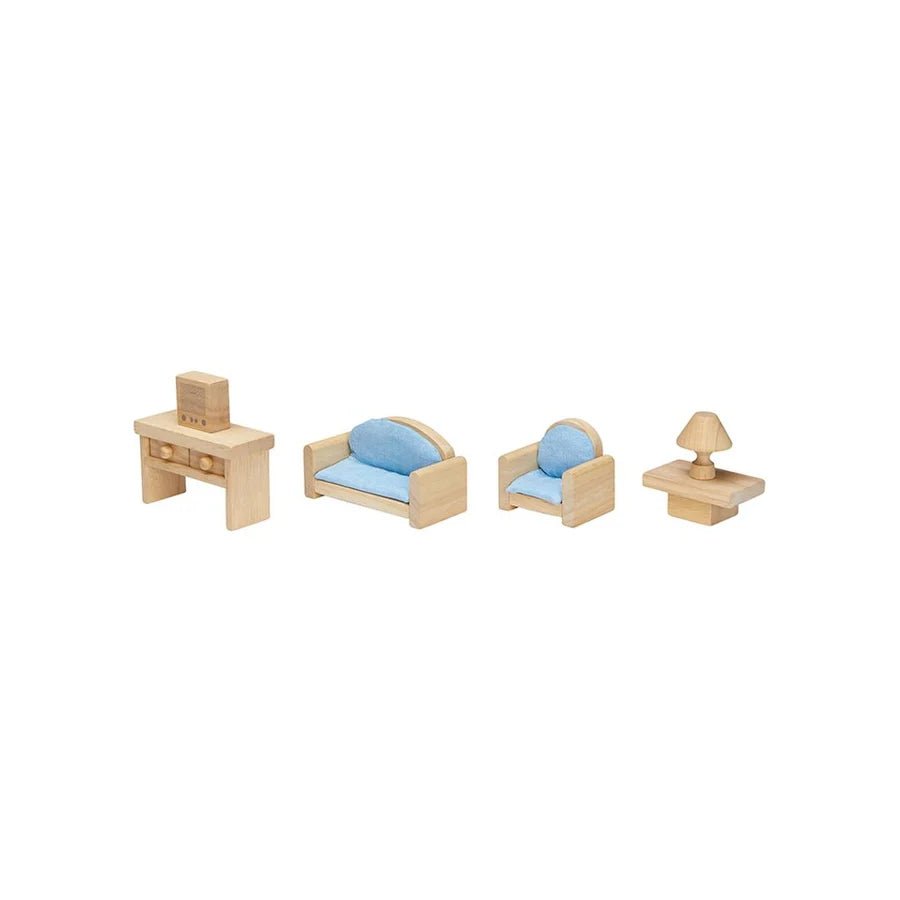 Wooden doll furniture lined in a row including a table with a tv, sofa, chair, coffee table with lamp