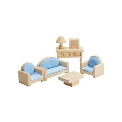 Wooden doll furniture on a white background including 2 chairs, 1 sofa, 1 coffee table, 1 table with drawers, 1 lamp, and 1 television.