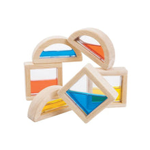 Wooden geometric shapes with colorful water inside on a white background