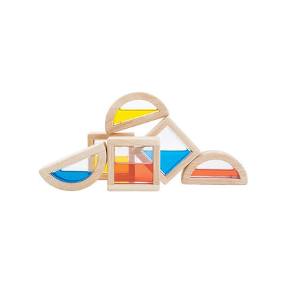 Colorful geometric wooden toys on a white background