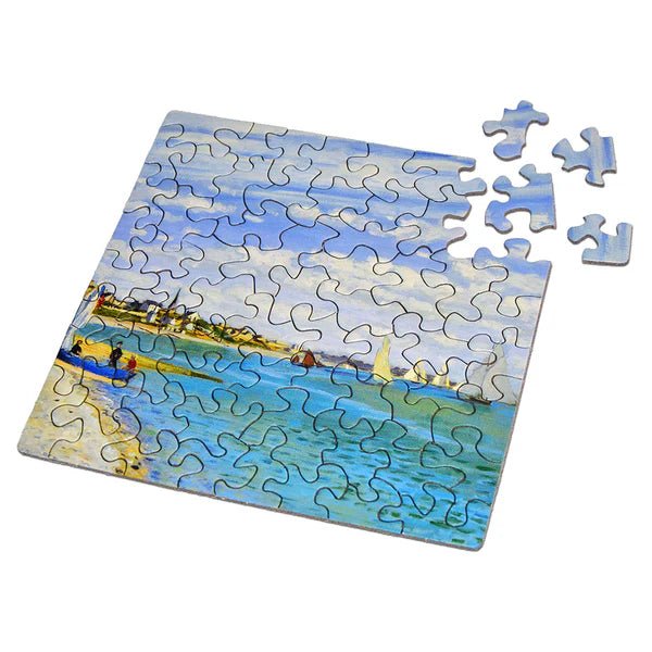 Jigsaw puzzle with a completed section of a beach scene on a white background