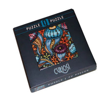 Curiosi puzzle box with colorful jellyfish design on a white background