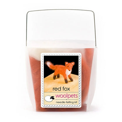 Frosted plastic box with materials to create a felted red fox with woolpets branding on a white background