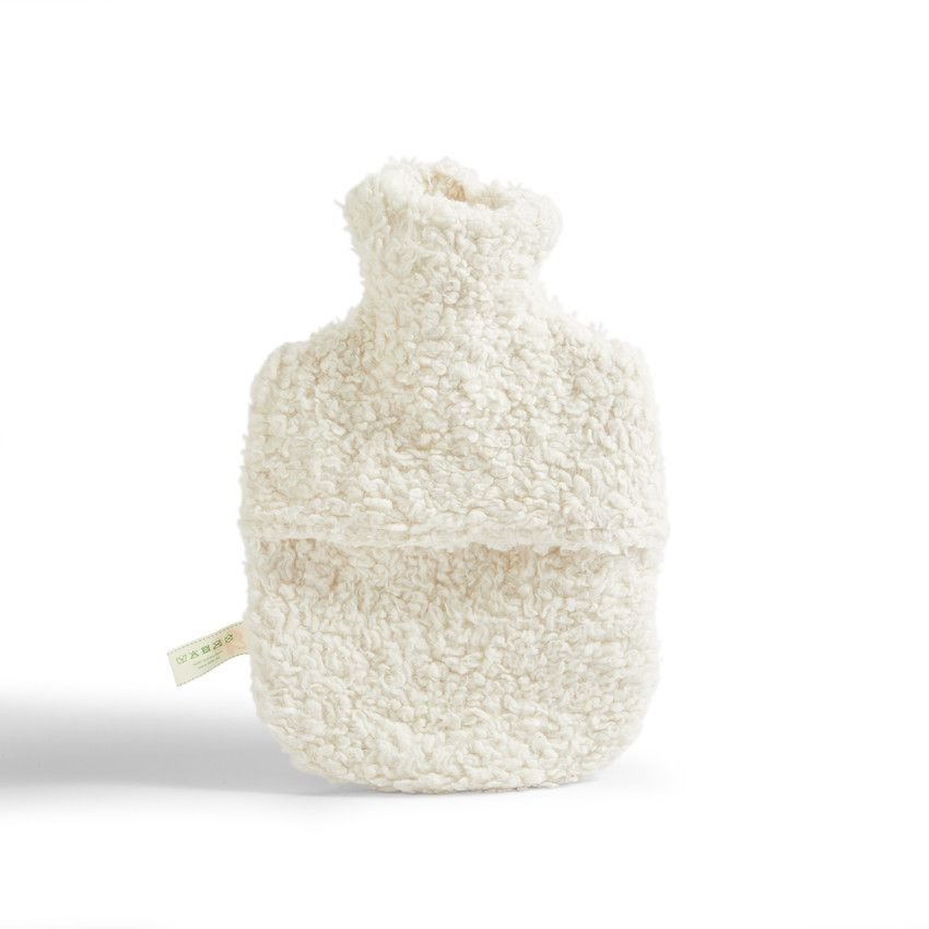 White fluffy hot water bottle on a white background