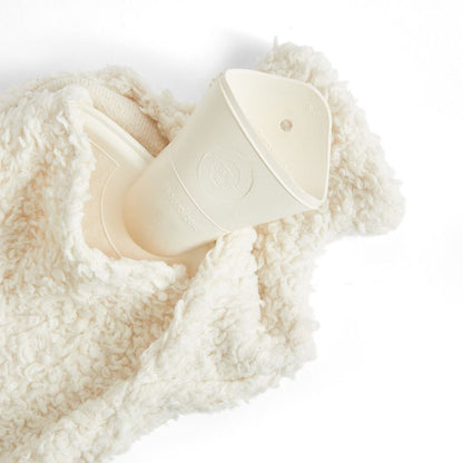 White silicone cup on a soft, textured white surface