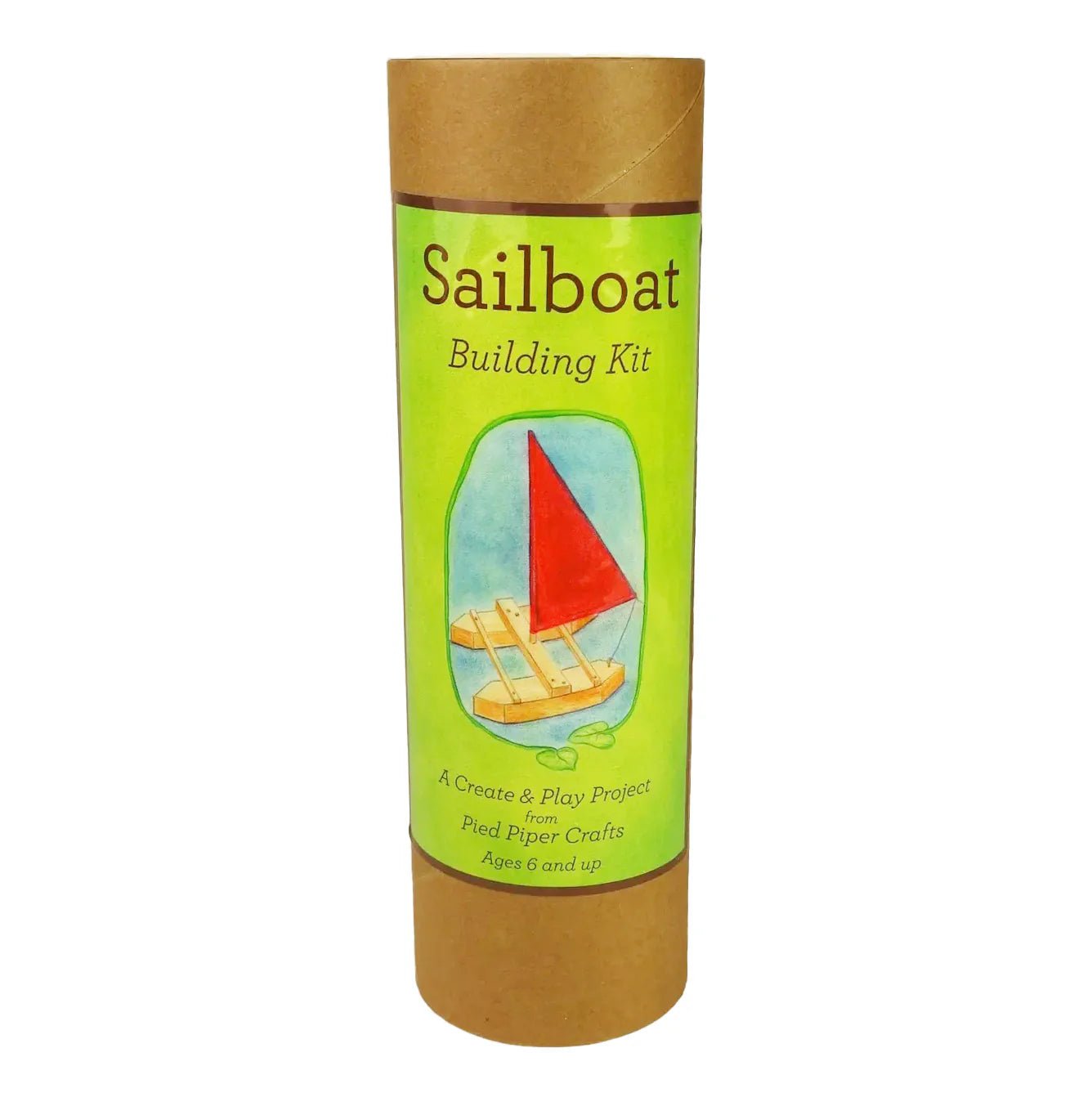 Sailboat building kit packaging with green label and brown cardboard tube on a white background