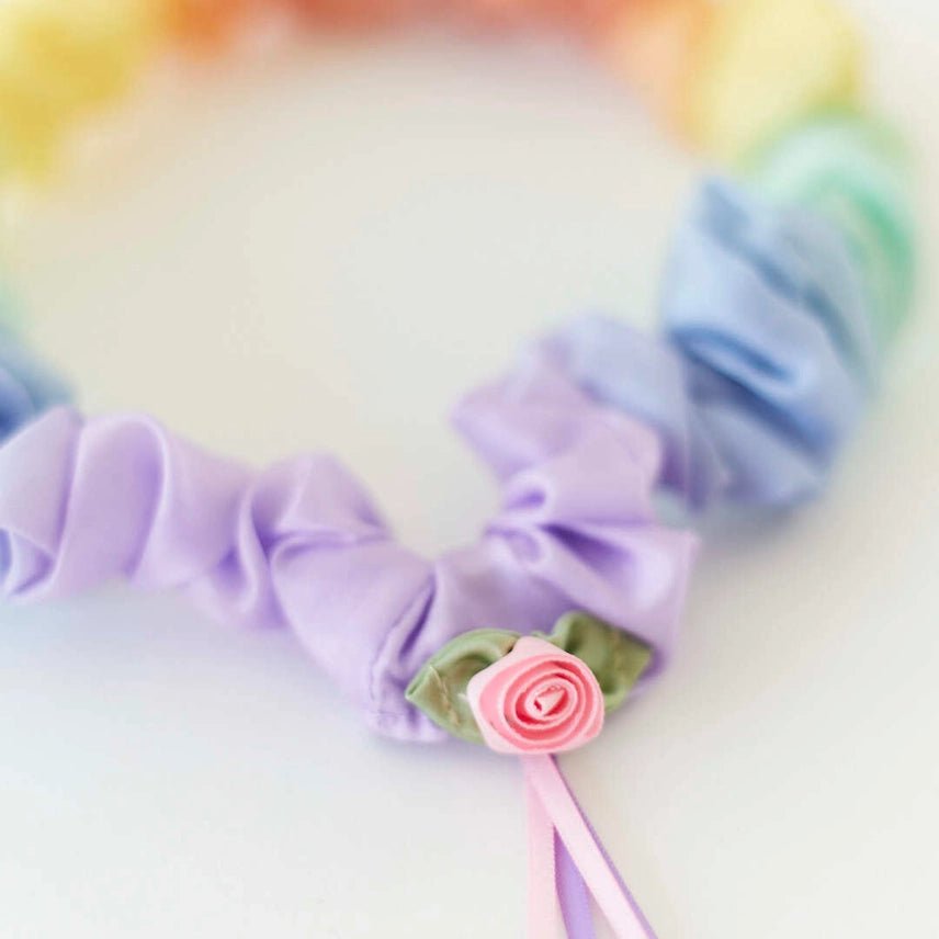 Close up of rose detail on pastel rainbow garland