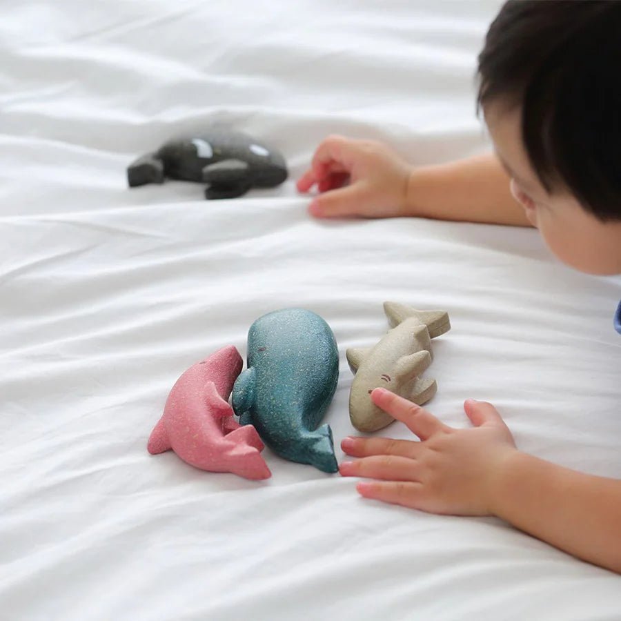 Set of colorful wooden sea creatures on a white background
