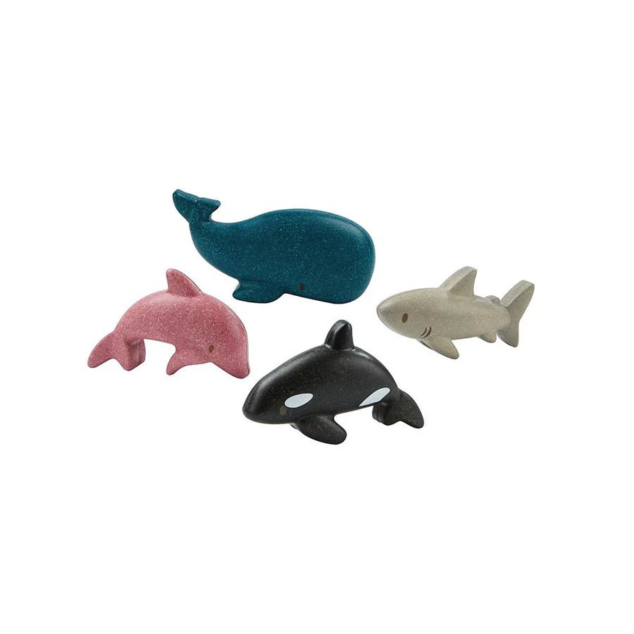 Set of colorful wooden sea creatures on a white background