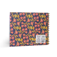 Floral patterned notebook with visible brand label on a white background