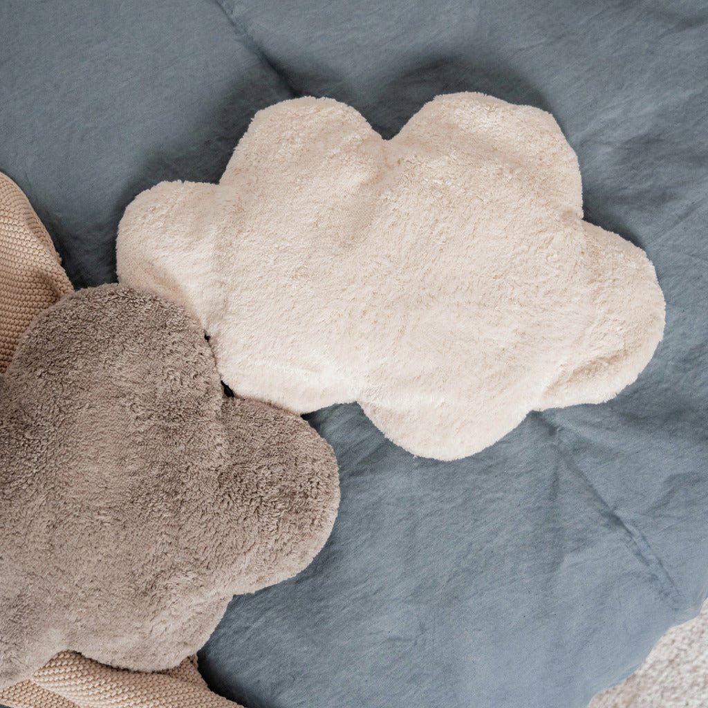 White cloud pillow next to gray cloud pillow