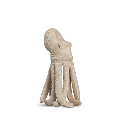 Beige stuffed octopus toy on a white background