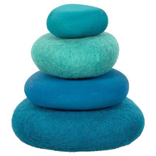 4 felt stones in blue tones stacked from largest to smallest on a white background