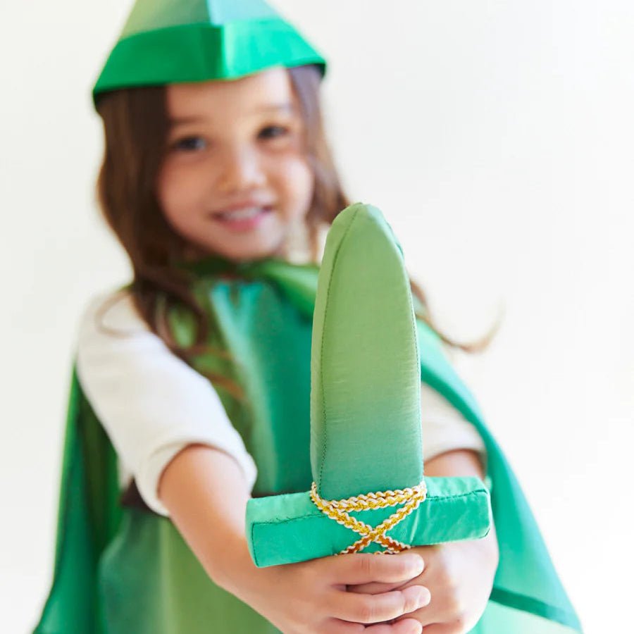 Child in a green costume with a hat and cape, holding a green silk dagger.