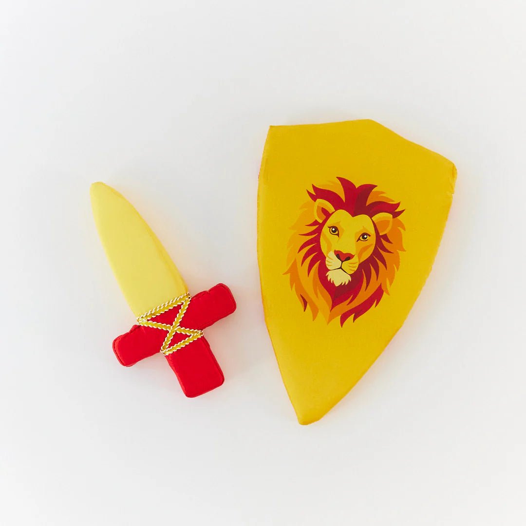 Red silk dagger with yellow blade and yellow silk shield with red, orange, and yellow lion head on a white background