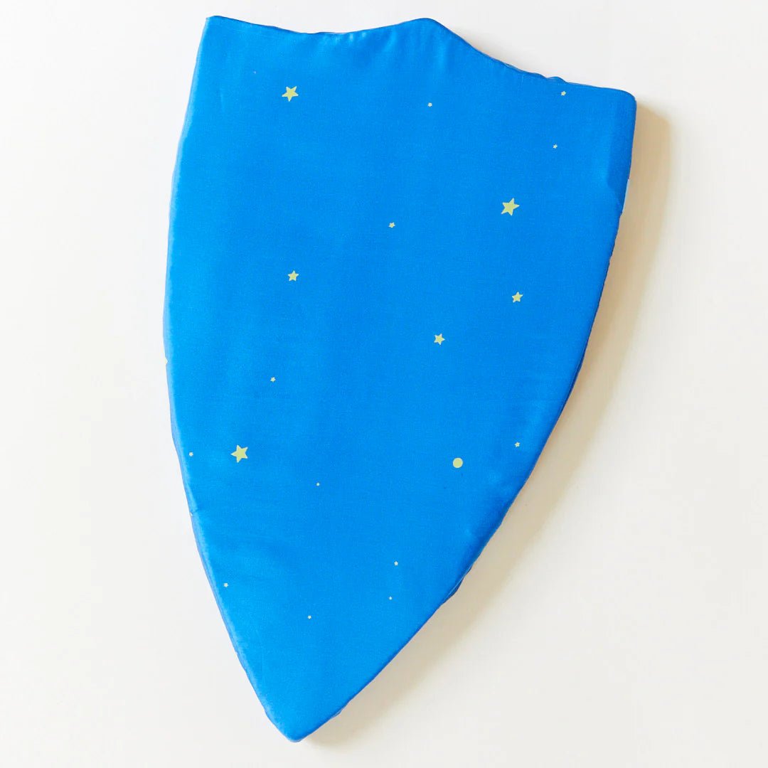 front of blue silk shield with yellow stars on a white background