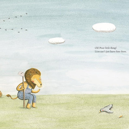 A whimsical illustrated scene showing a lion standing on grassy ground with a gardening hoe, looking toward a bird on the ground, a tree stump, and a rock. The background is a pale blue sky with clouds and birds, and small text appears on the right.
