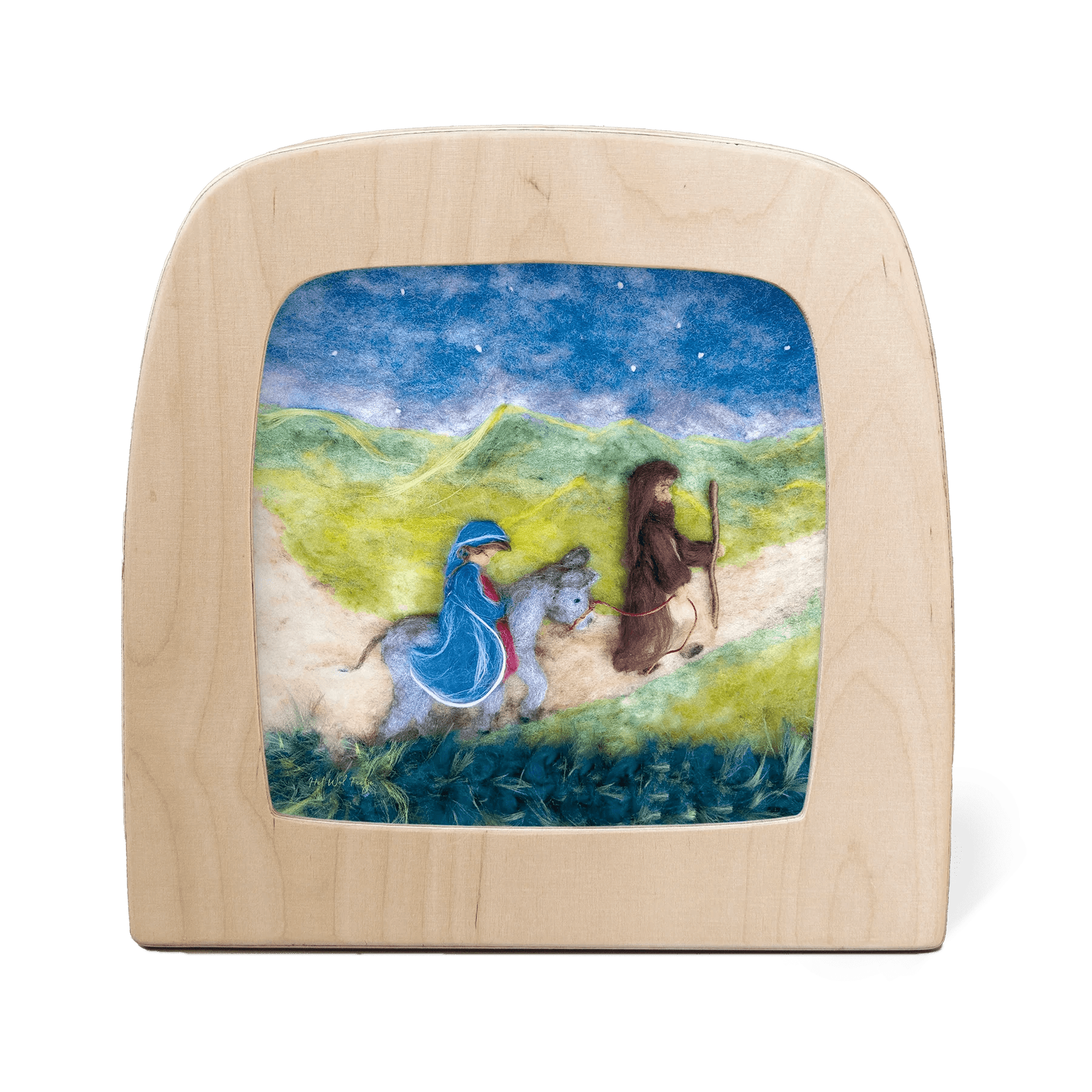 Silhouette of Joseph leading Mary on a donkey