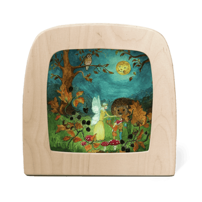 Silhouette of a yellow fairy in the forest, surrounded by woodland creatures