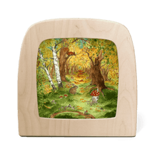 Autumn forest scene featuring a bunny and a mushroom house