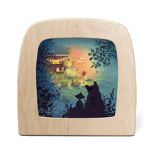 Silhouette of a gnome and cat overlooking animals having a barn party