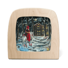 Wooden Toverlux frame with a winter scene painting of a person in a red coat on a horse.