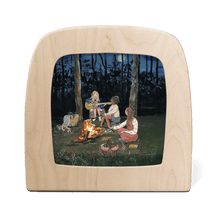 Toverlux lamp with silhouette featuring three girls sitting around campfire