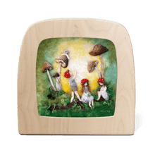 Silhouette of children with toadstool hats playing amongst mushrooms