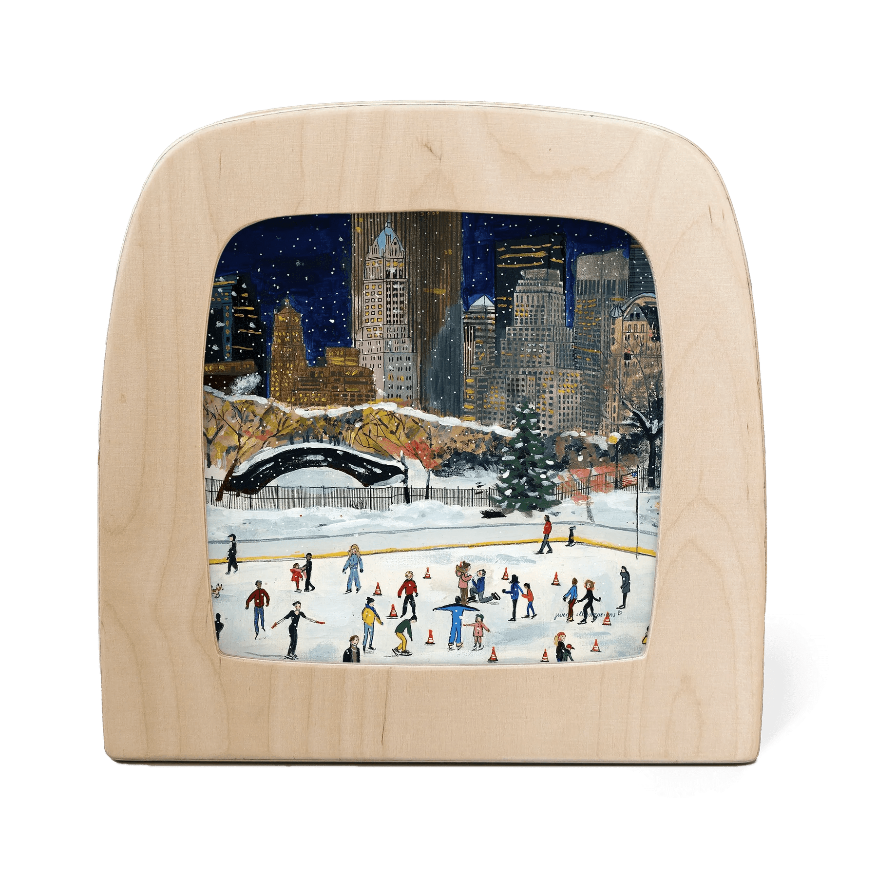 Wooden frame with silhouette of a New York cityscape in winter with people ice skating below