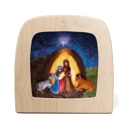Silhouette of a Nativity scene featuring Mary, Joseph, Baby Jesus, and two cows