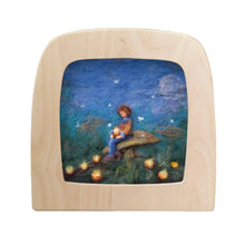 Wooden frame with a scene of a child sitting on a toadstool under a starry sky.