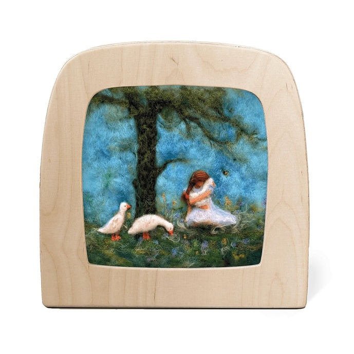 Silhouette of a girl sitting under a tree with three white geese