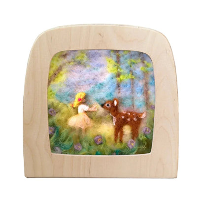Silhouette of a girl and a deer in the forest