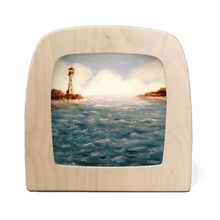 Wooden picture frame with a scenic view of a lighthouse on water.