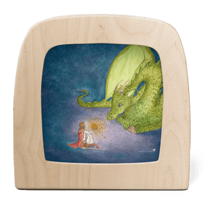 Silhouette of a person sitting in front of a dragon